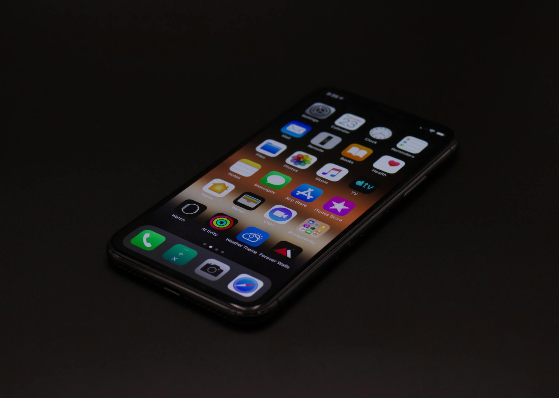 iPhone laying screen up on a black surface